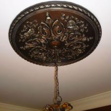 Ceiling medallion with worn aged metal look